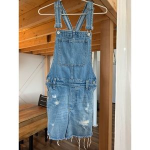 Madewell short denim overalls with raw hem.